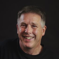 Portrait photo of Miles Hudson, author of detective novels in the Penfold series, including The Cricketer's Corpse.