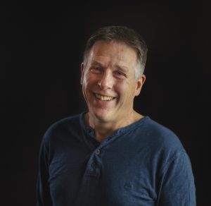 Portrait photo of the author Miles Hudson